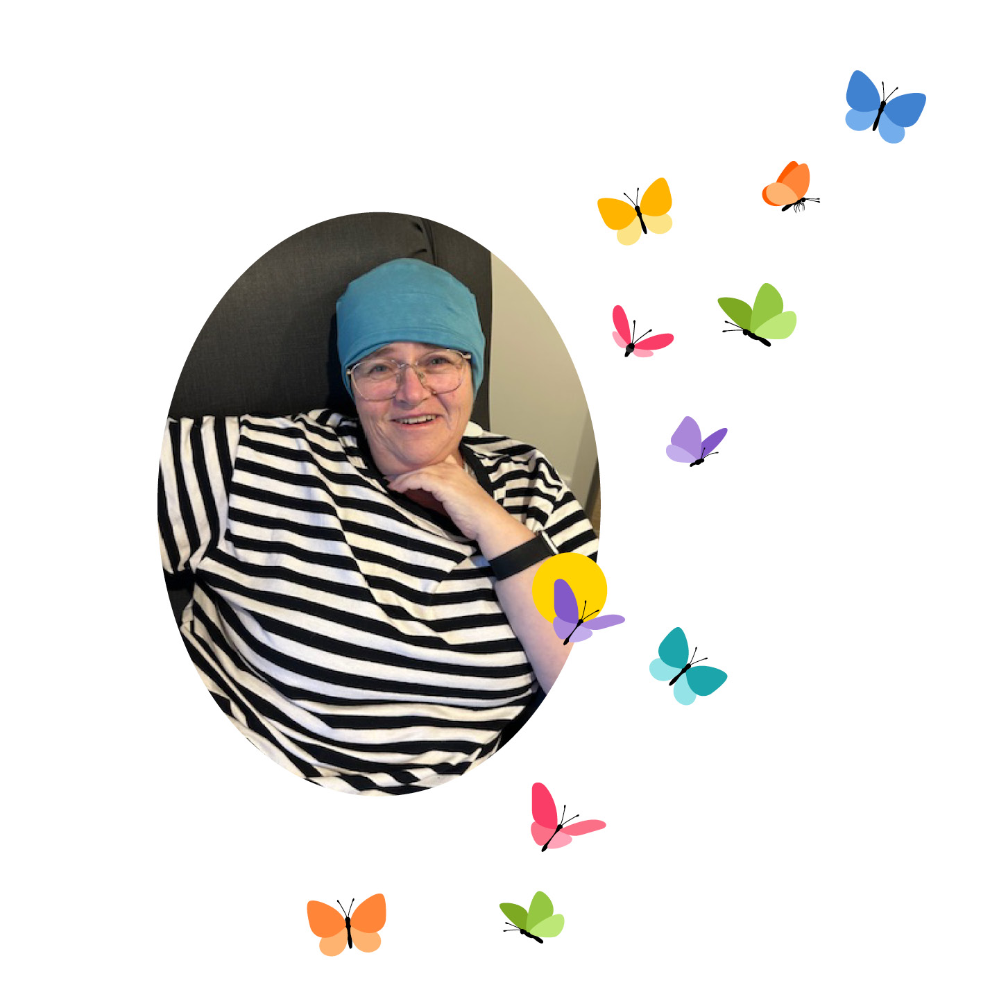Woman sitting smiling, wearing a teal coloured hair scarf, glasses and black and white striped t shirt