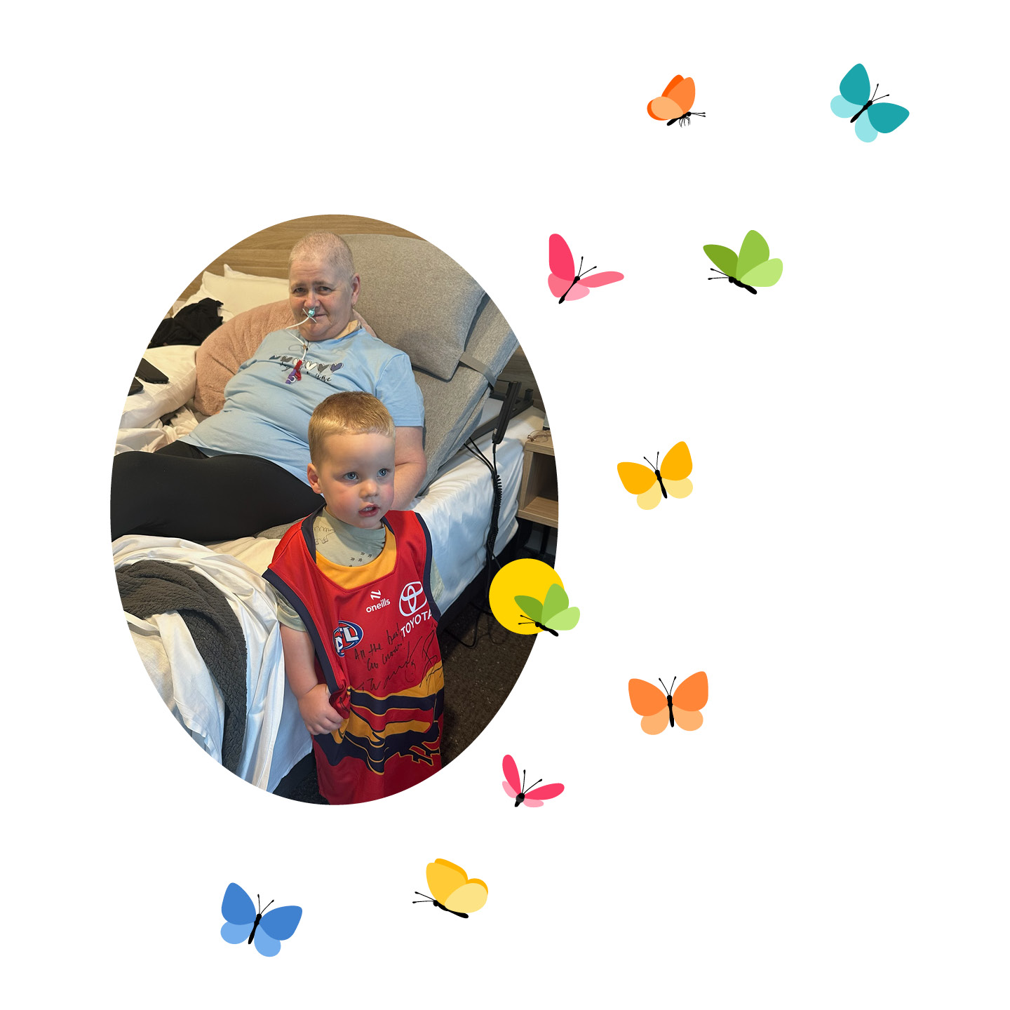 Woman sitting up in bed with her toddler grandson standing at her bedside wearing a football gurnsey